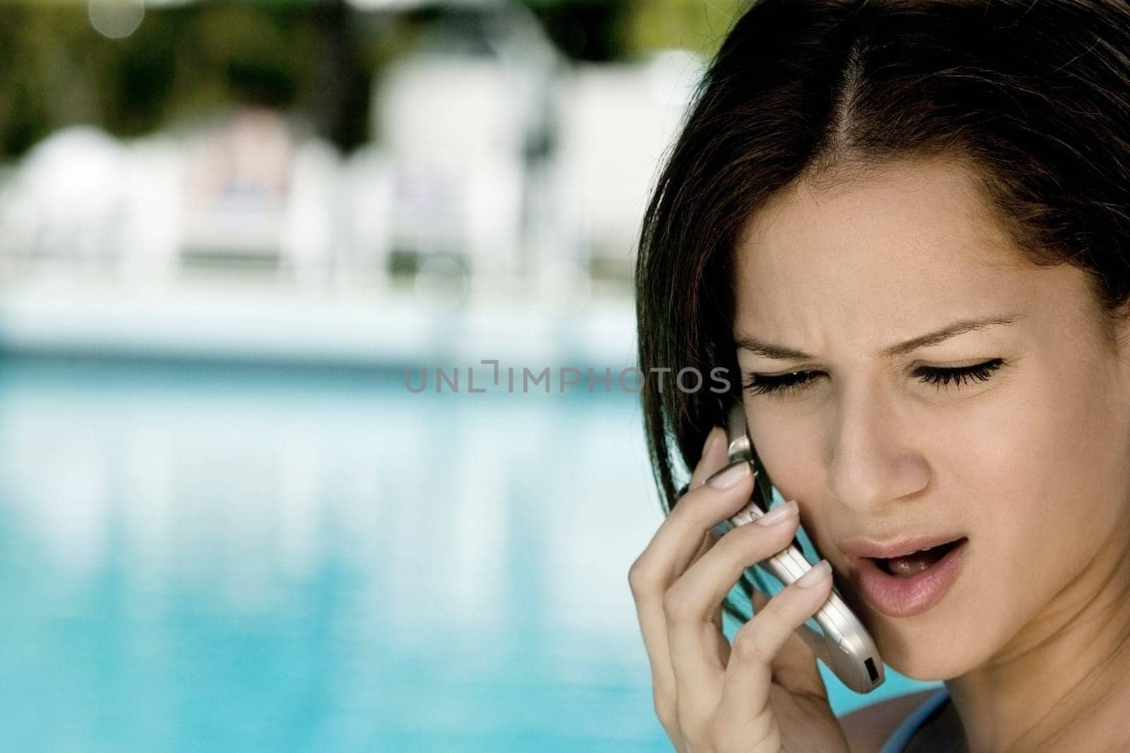 Close-up of a young woman talking on a mobile phone