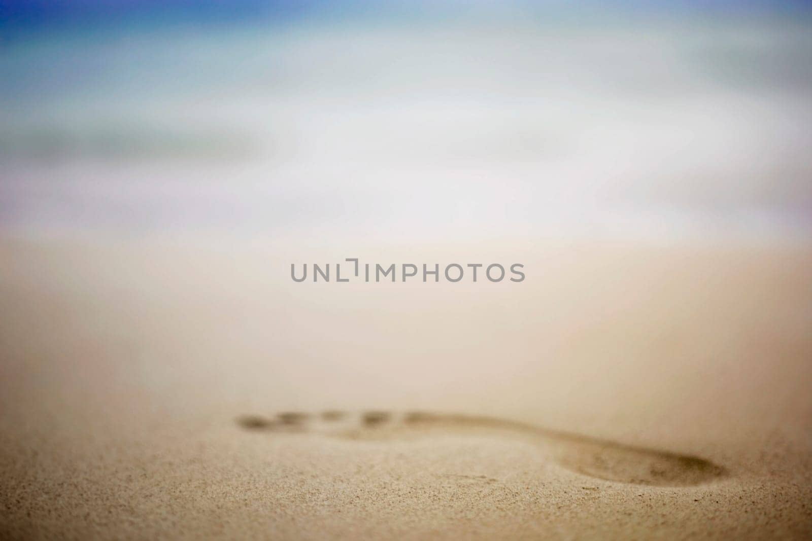 Close-up of a footprint in the sand