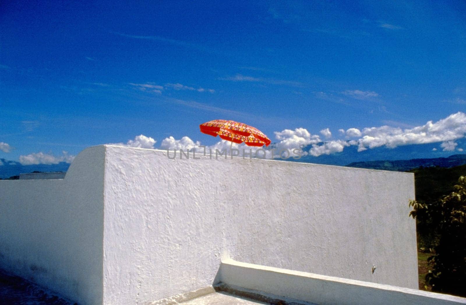 Low angle view of a patio umbrella on a terrace