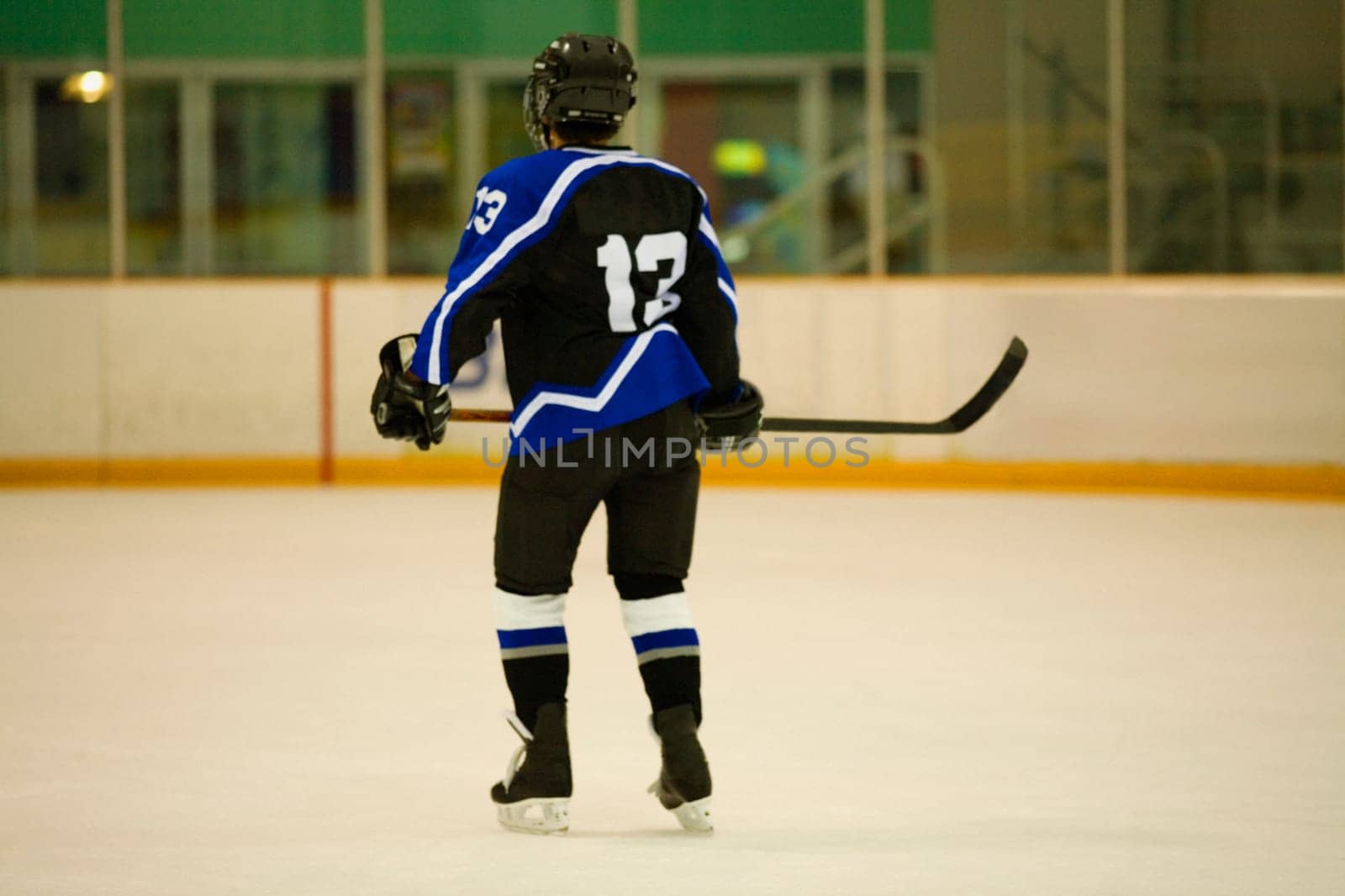 Rear view of an ice hockey player playing ice hockey