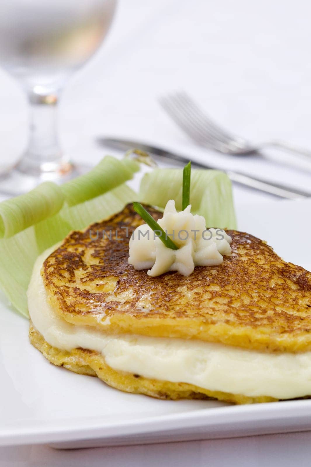 Close-up of a fish fillet with whipped cream on it