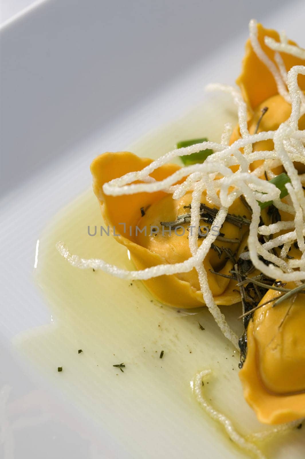 Close-up of dumplings with noodles in a plate