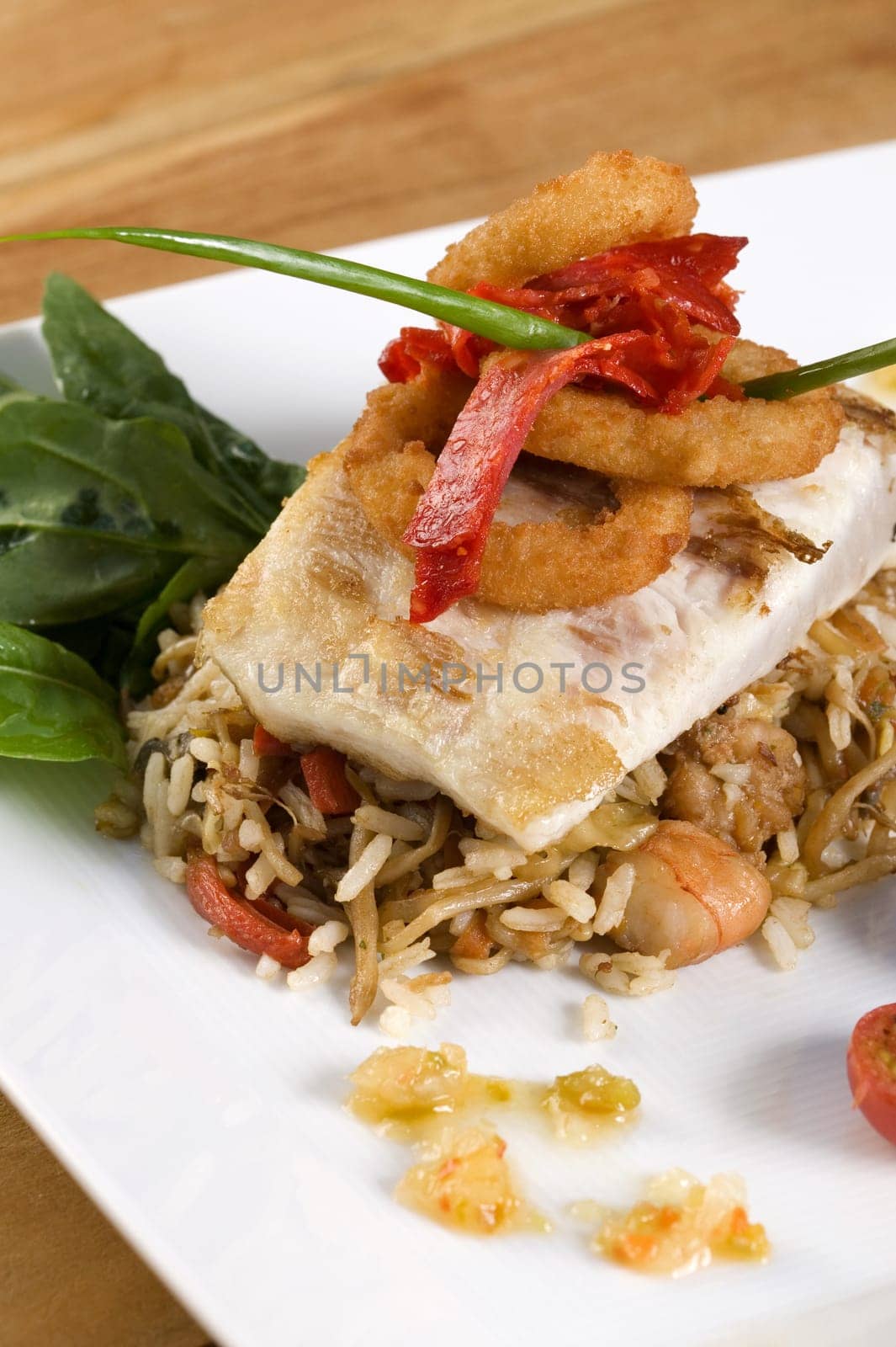 Close-up of rice and a fish fillet in a plate