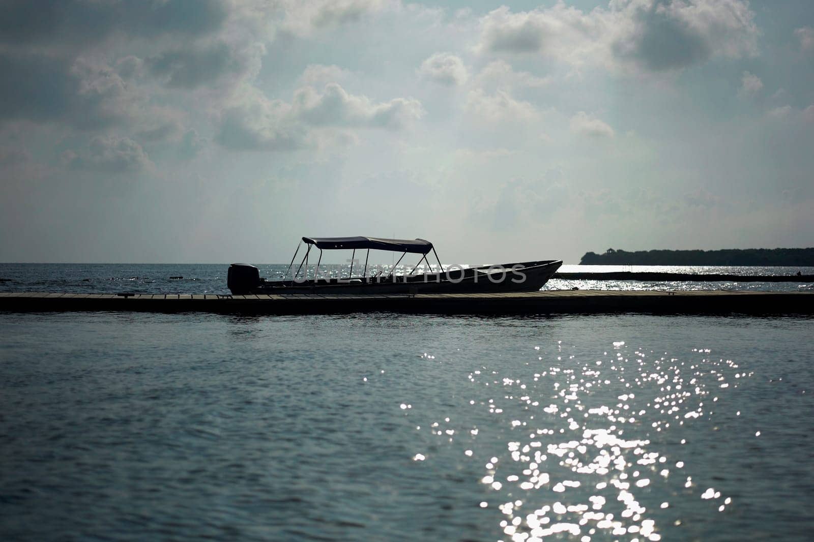 Motorboat moored at a pier