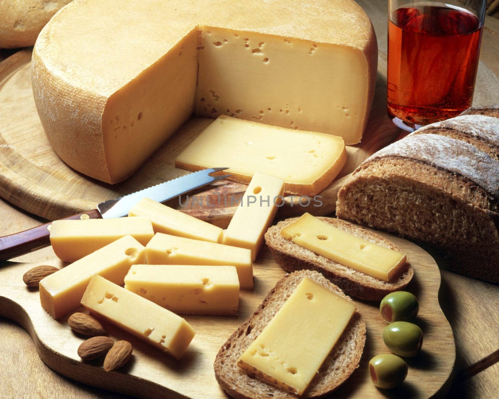 High angle view of cheese with bread and olives