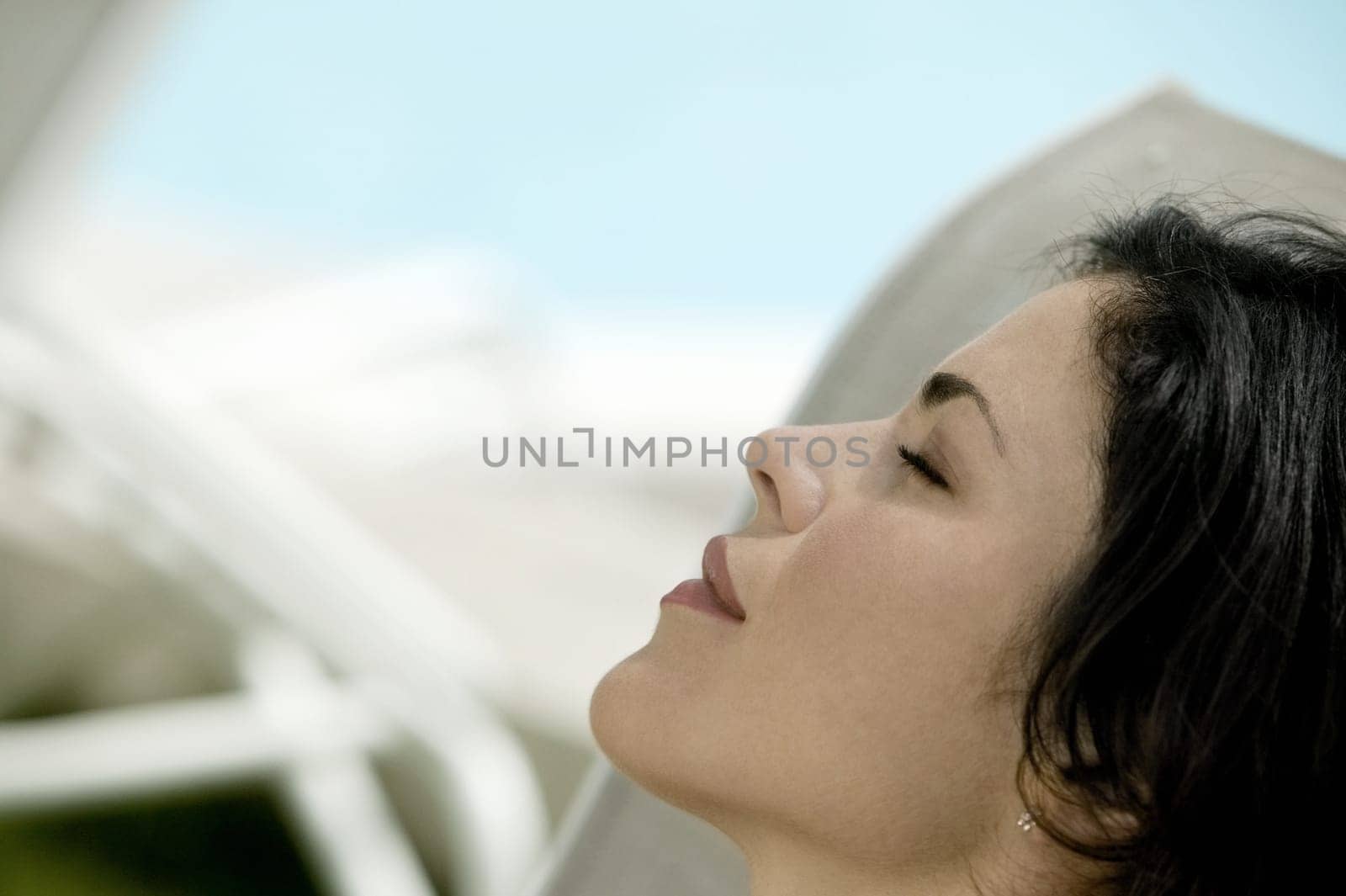 Close-up of a young woman with closed her eyes