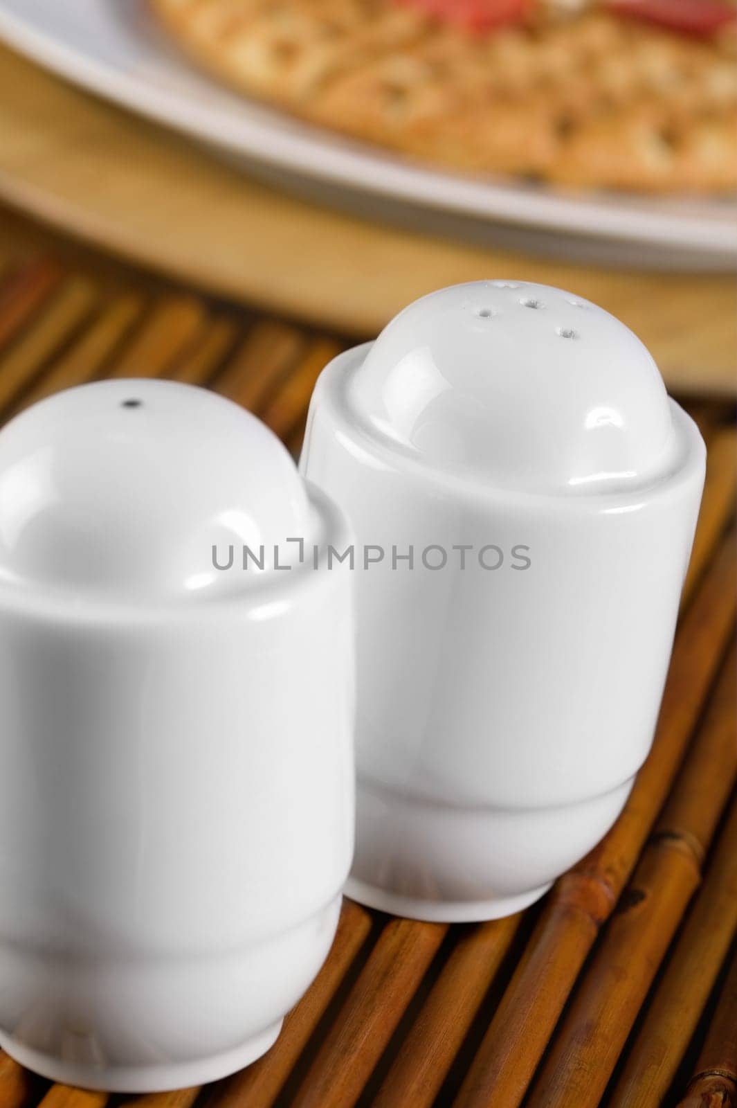 Close-up of a salt shaker and a pepper shaker