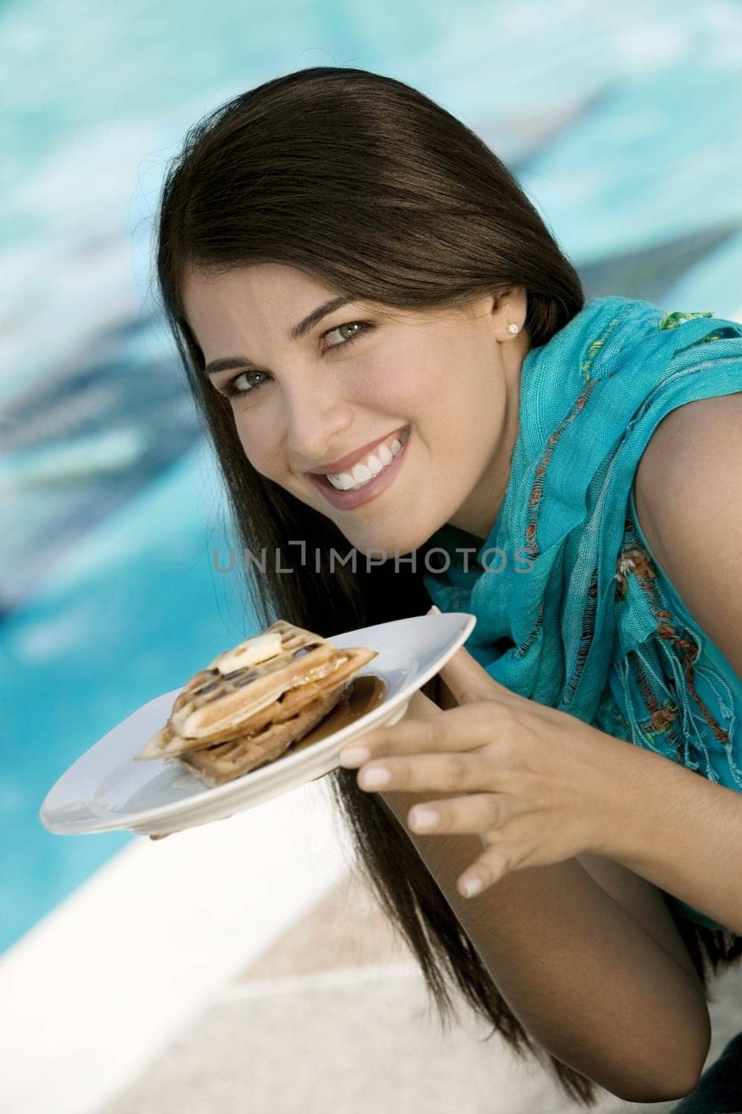 Portrait of a young woman holding a plate