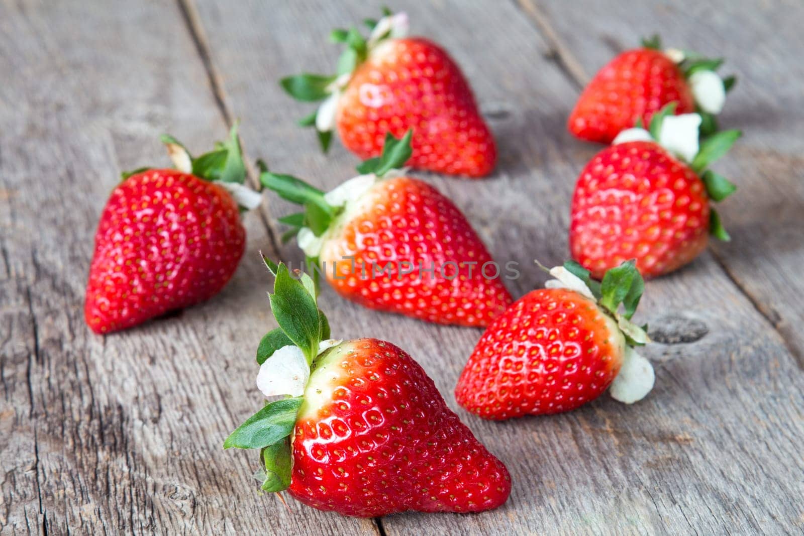 Close up of Fresh strawberries on wood table background