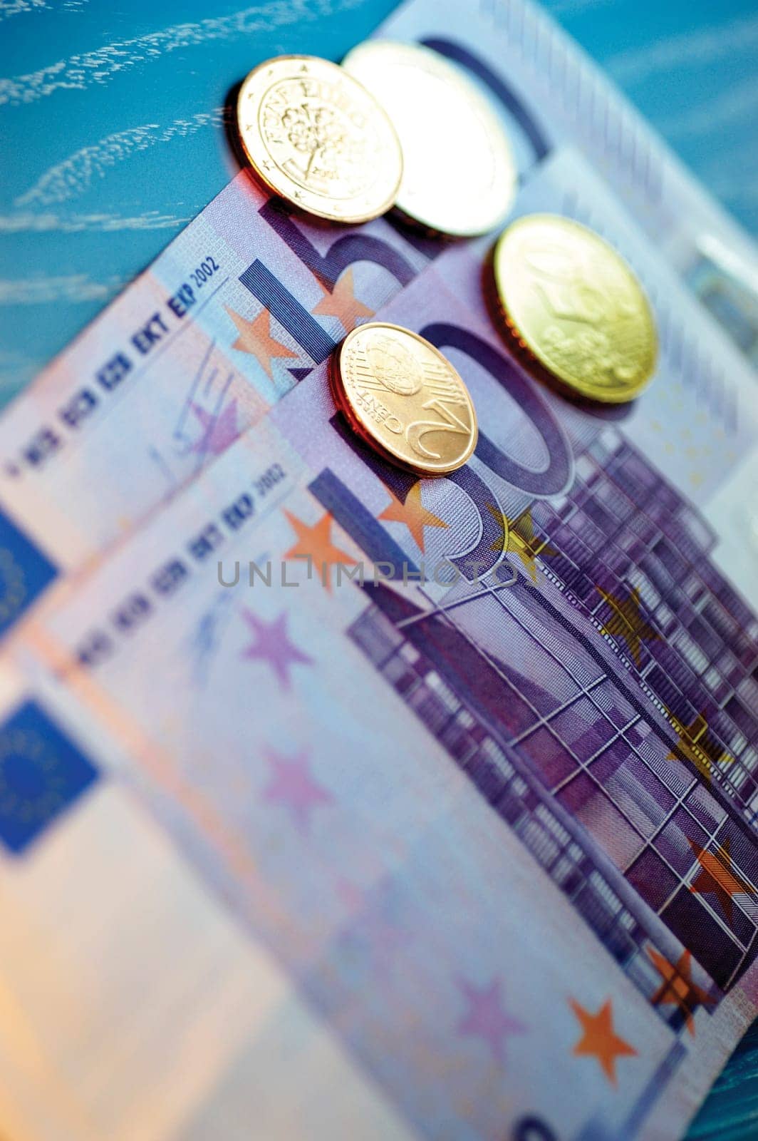 Close-up of Eurocent coins on Euro banknotes