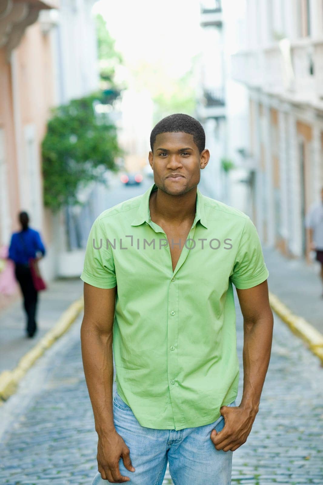 Portrait of a young man standing on the street