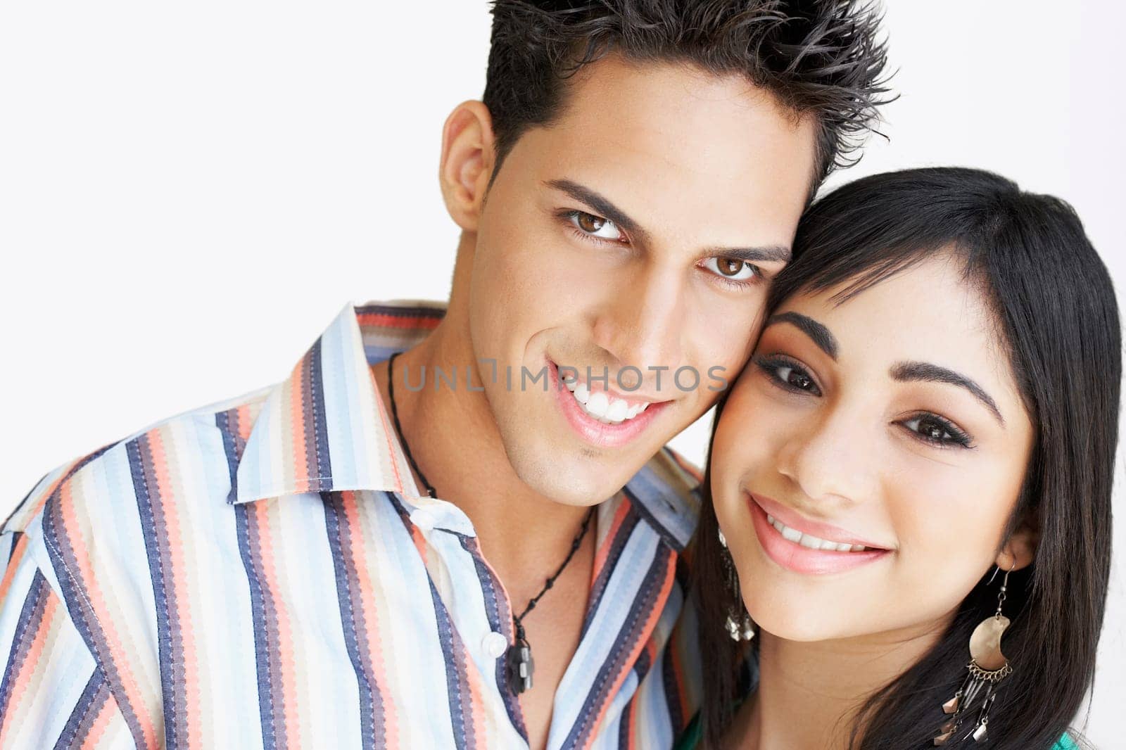 Portrait of a young man and a teenage girl smiling