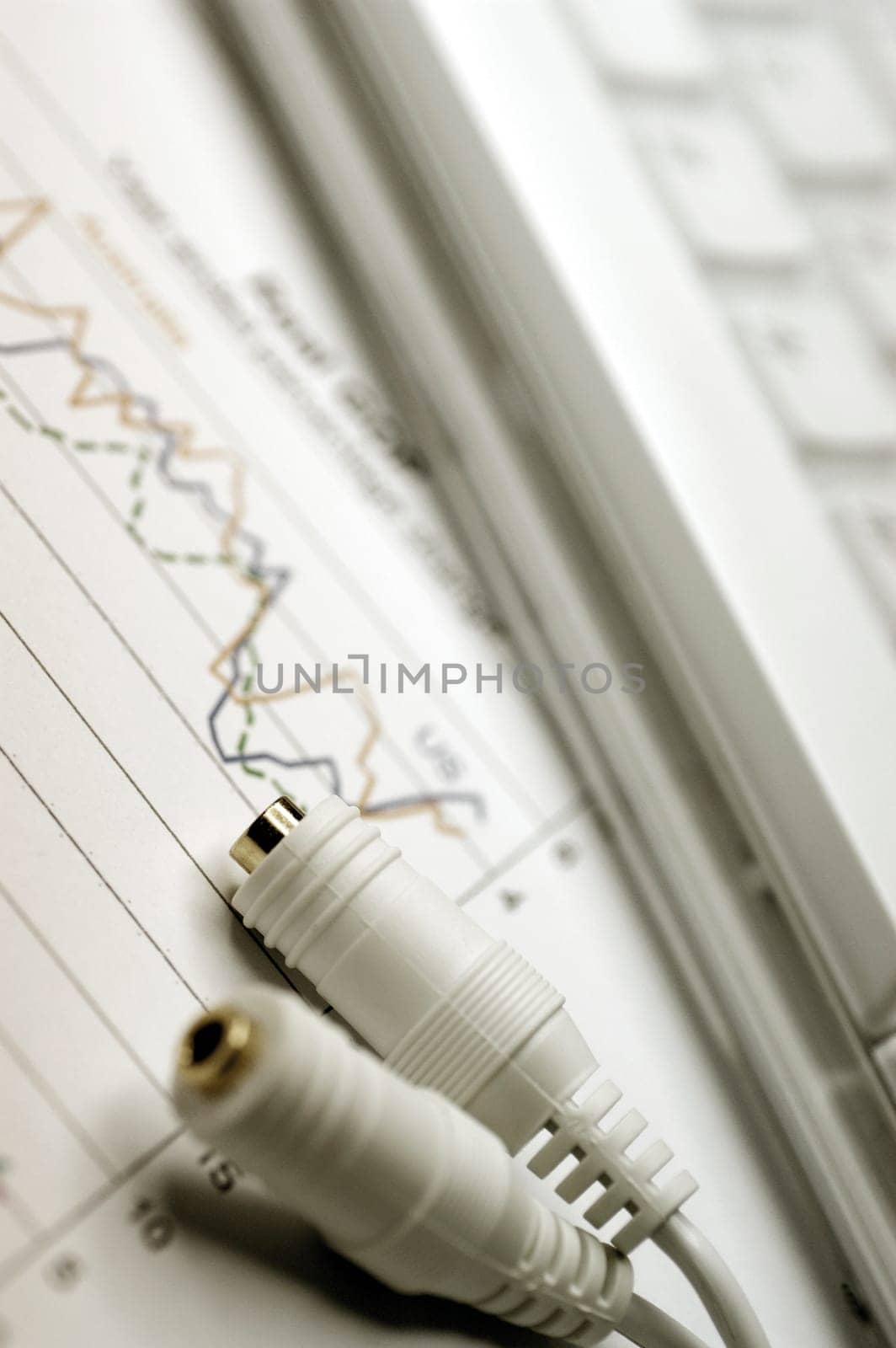 Computer keyboard, cable and graph, close-up