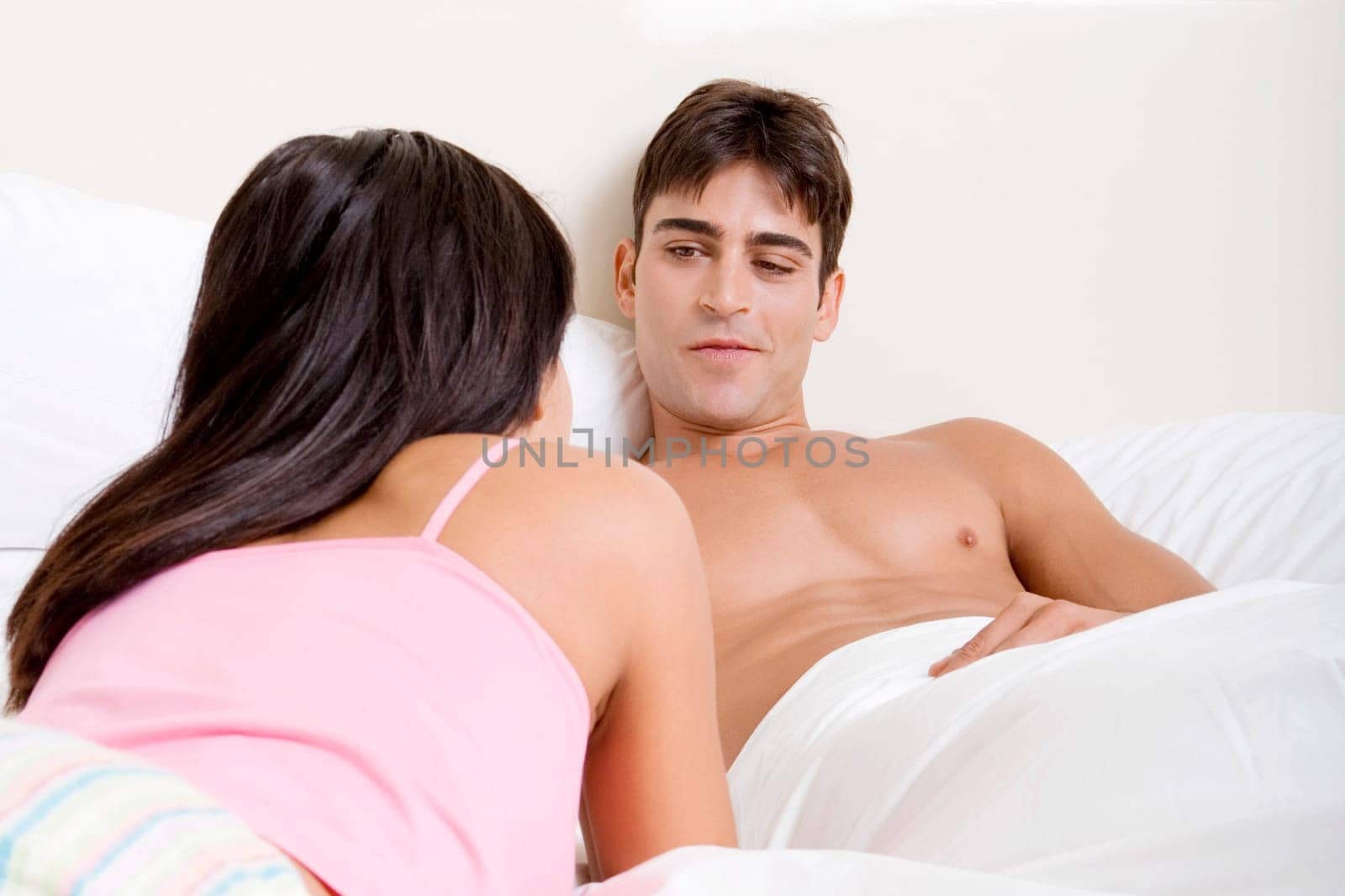 Young couple lying on the bed