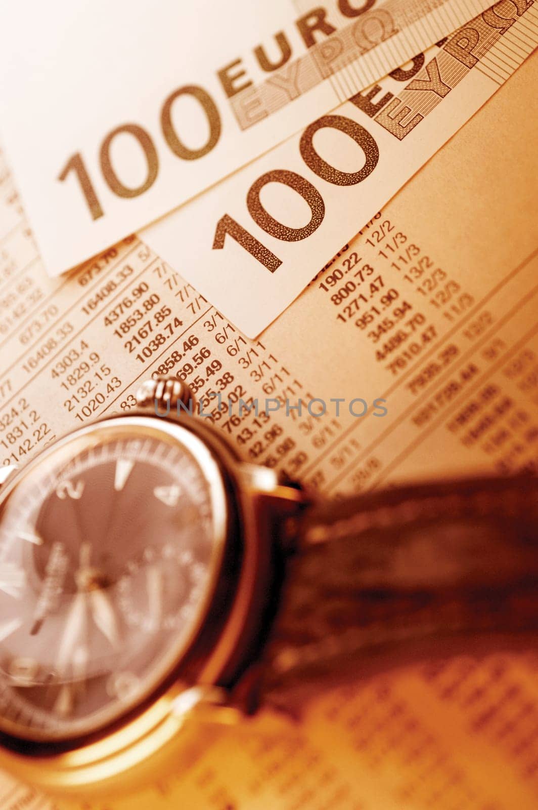 Watch, Euro bank notes and paper with financial figures