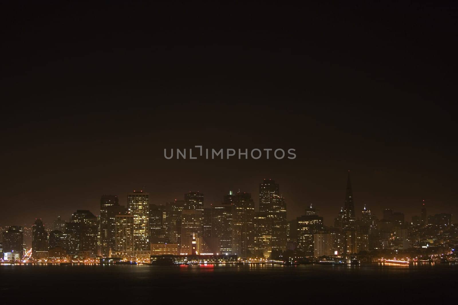 Illuminated buildings at waterfront, California, USA