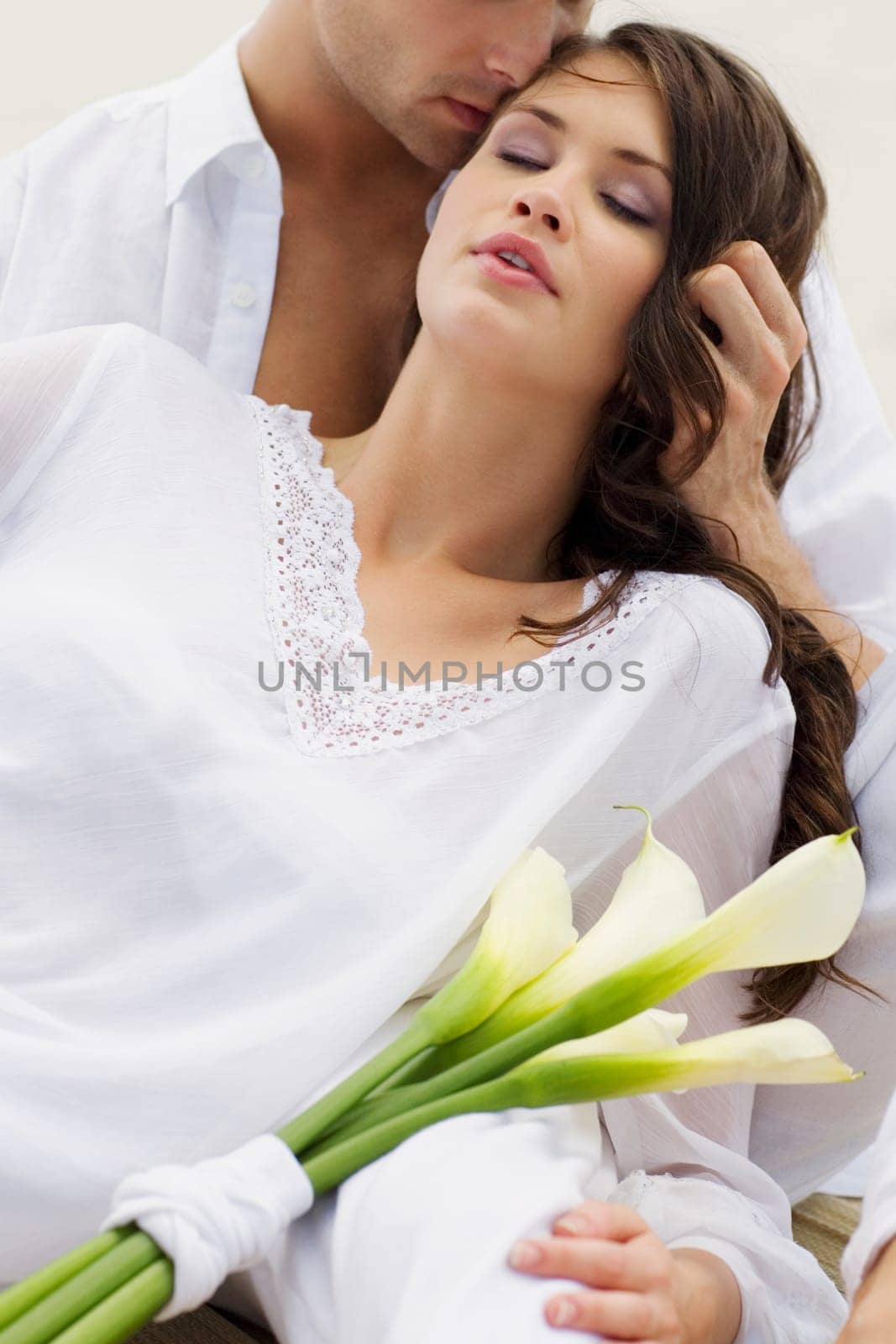 Close-up of a young man kissing a young woman