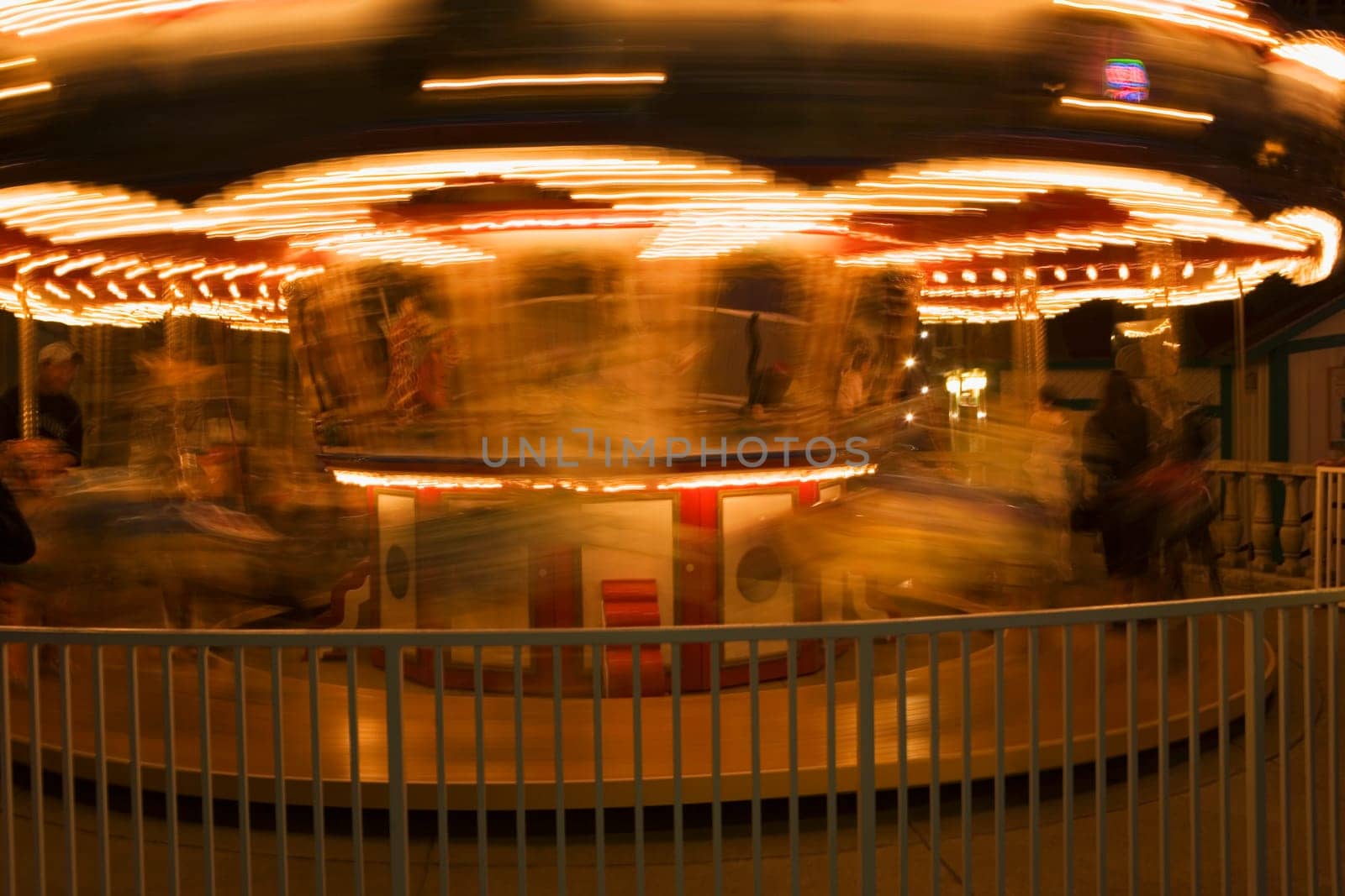 Close-up of a carousel at night