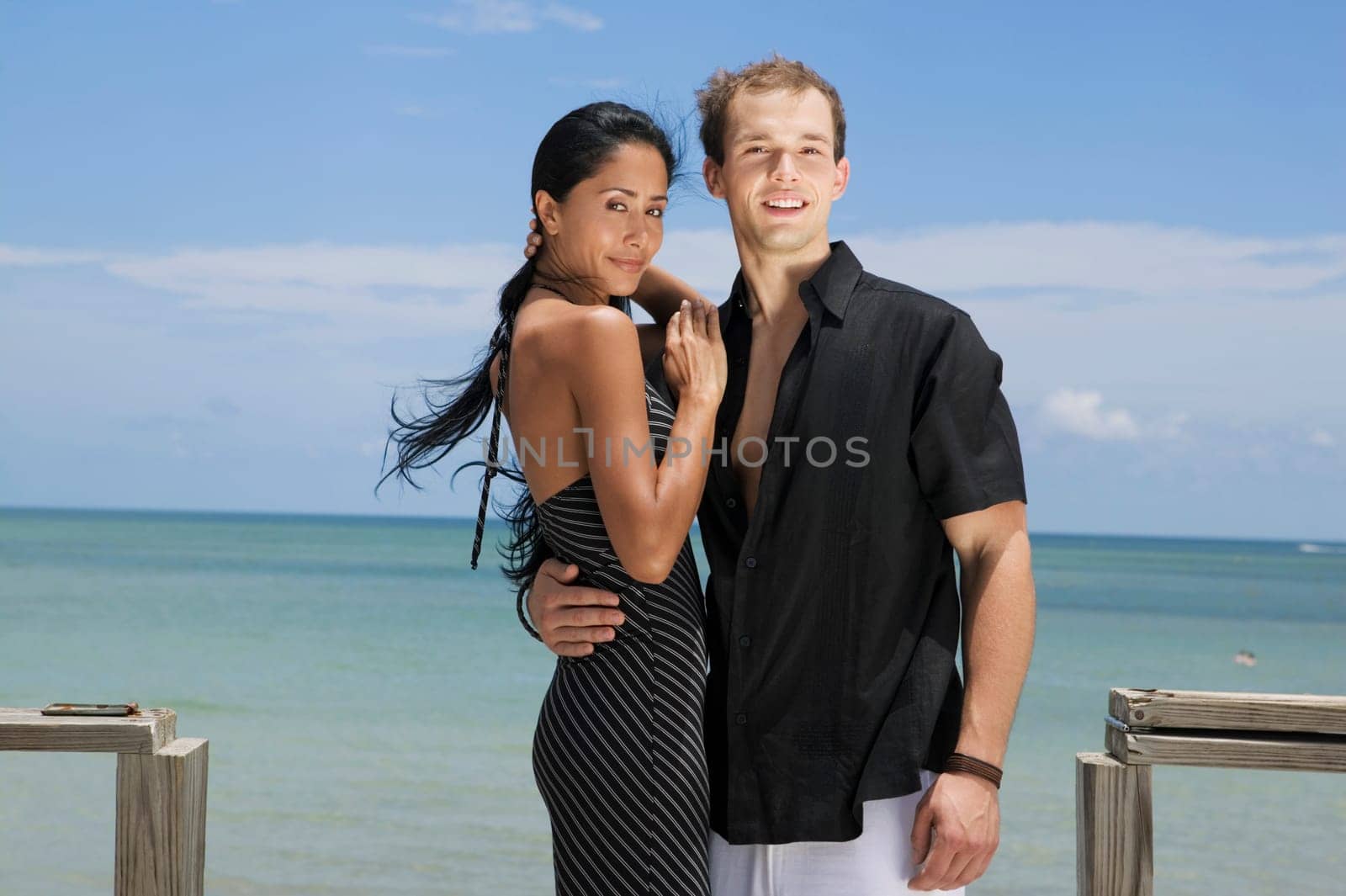 Portrait of a young man embracing a young woman