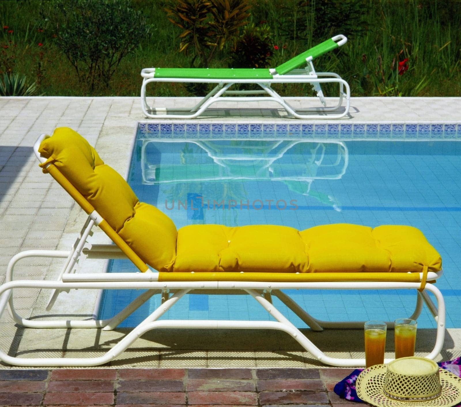 Empty chairs at the poolside