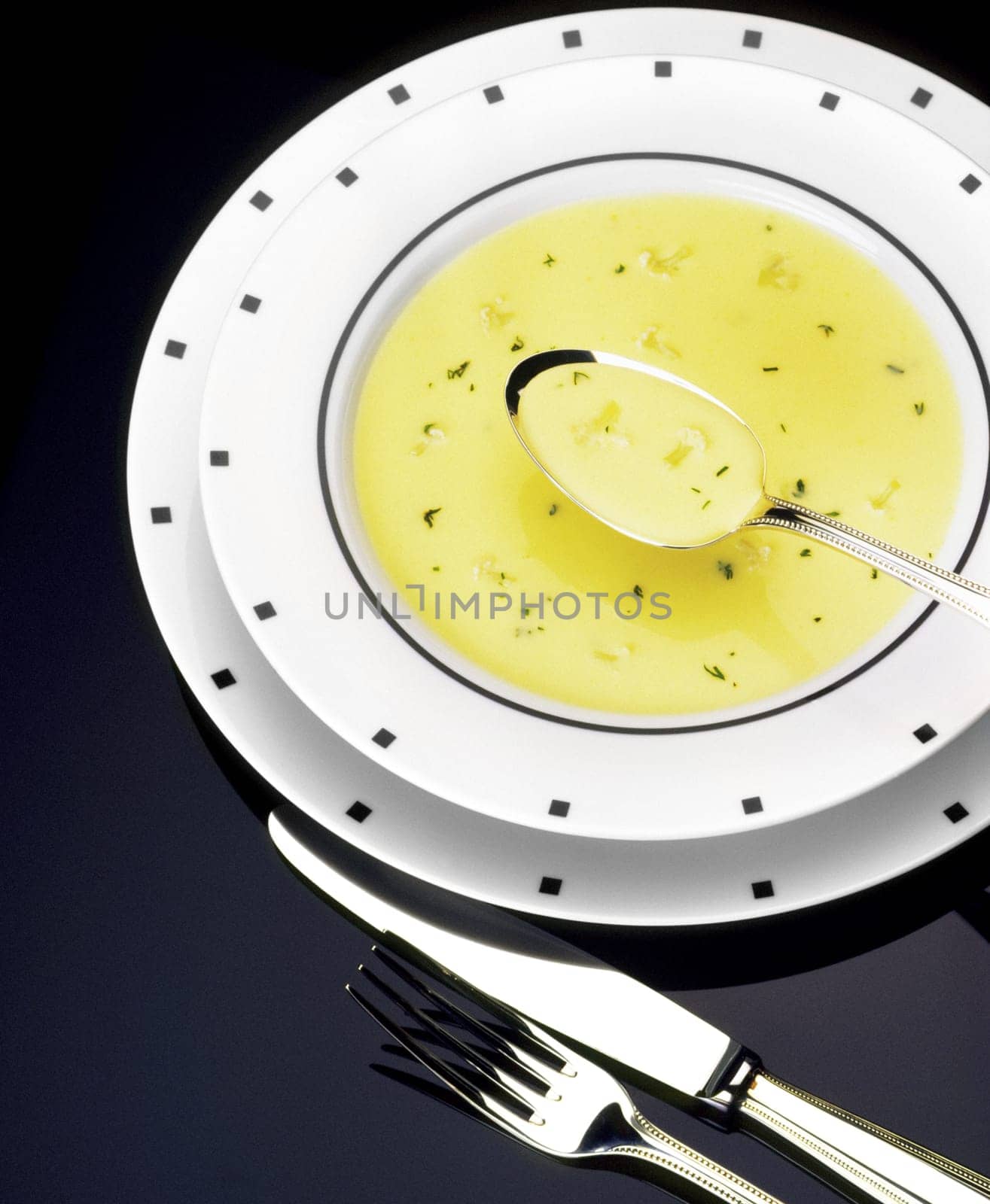 High angle view of a spoon in bowl of soup
