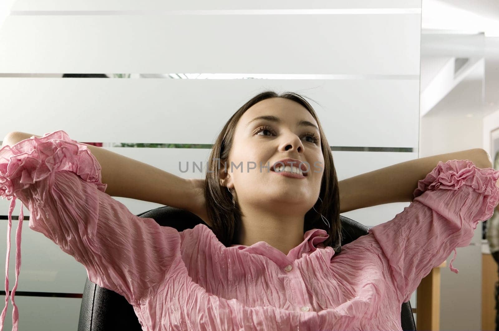 Close-up of a businesswoman sitting on a chair