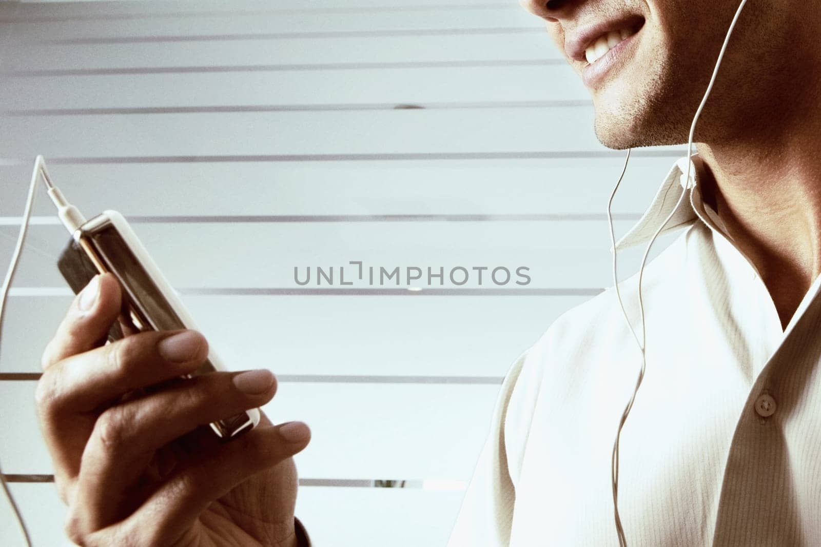 Close-up of a young man listening to music