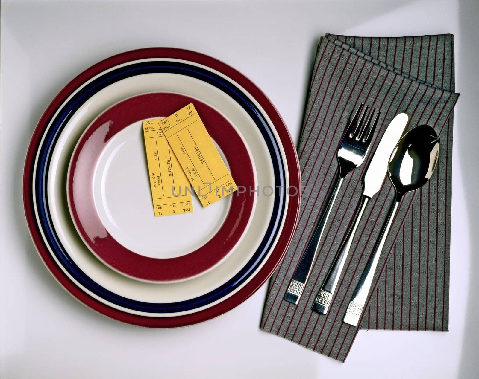 High angle view of two admission tickets on a plate
