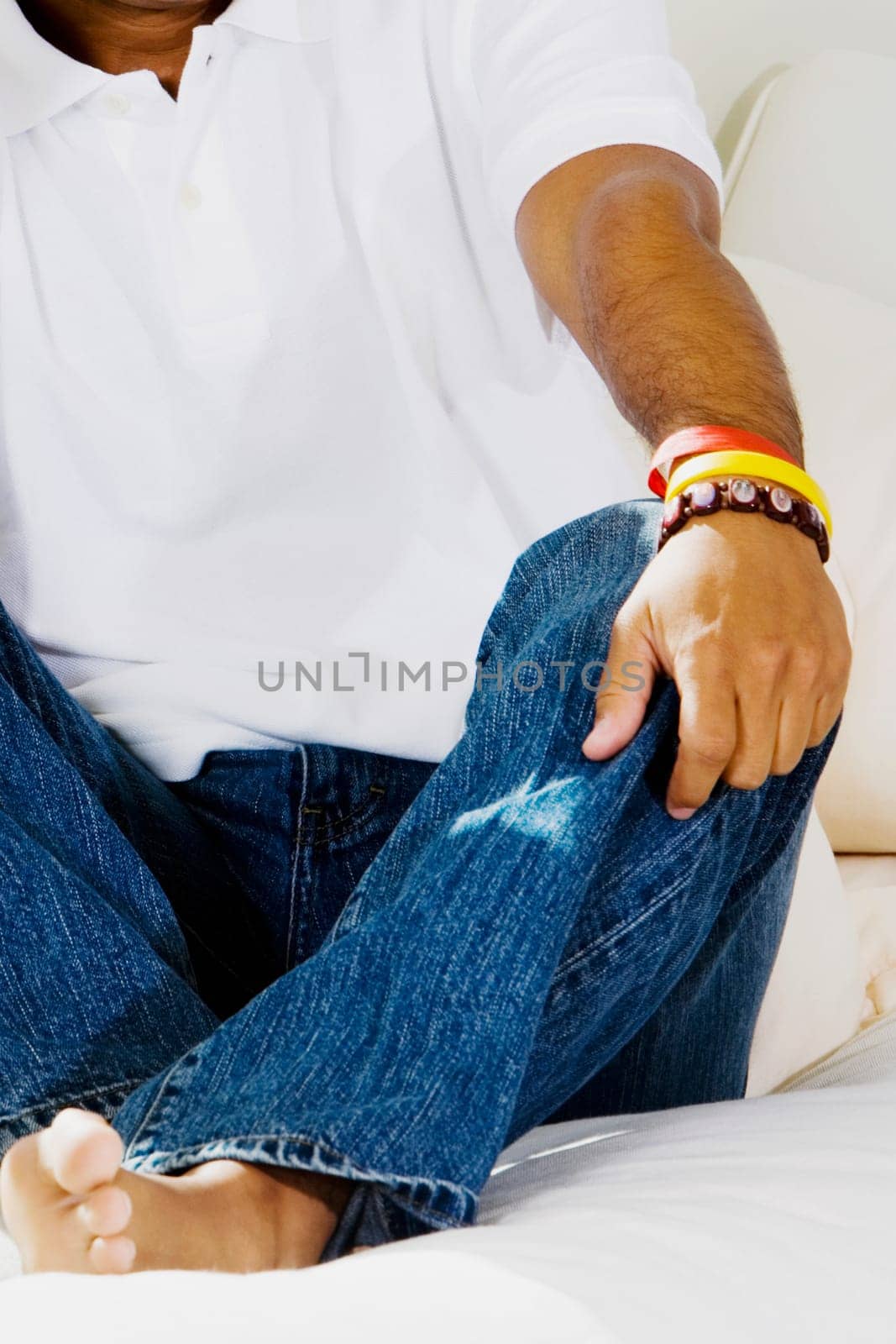 Close-up of a man sitting on the bed