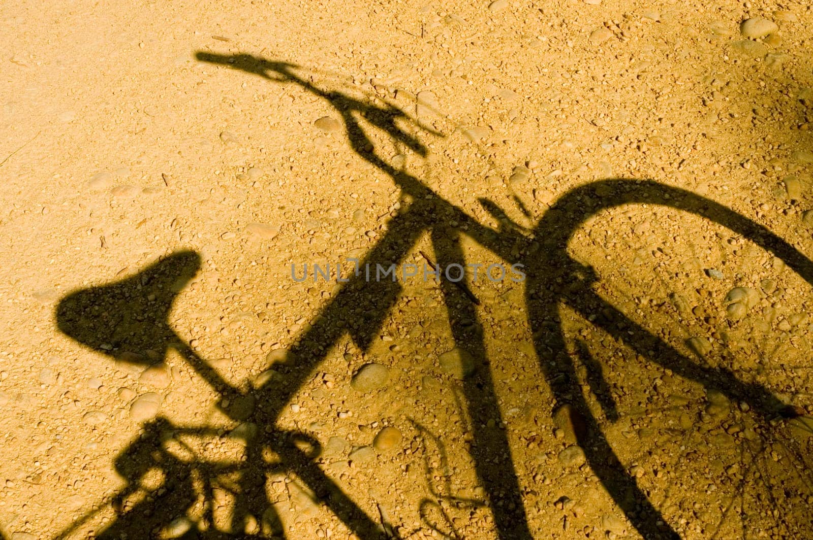 Close-up of the shadow of a bicycle