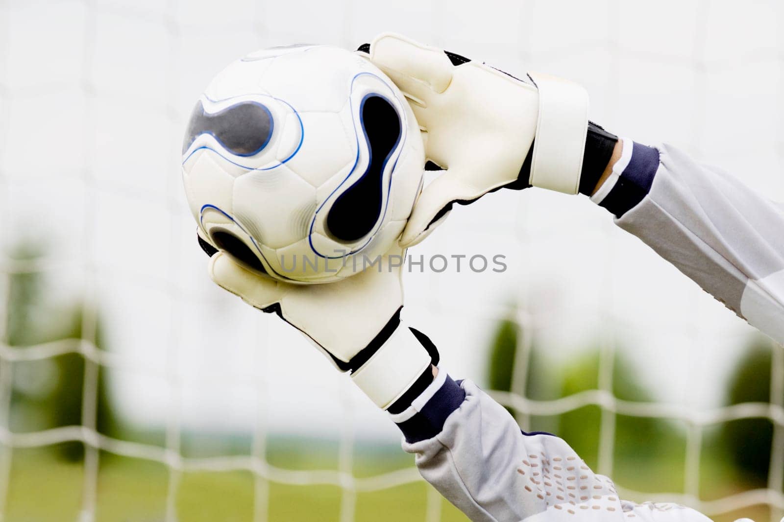 Close-up of a goalieŽs hands making a save