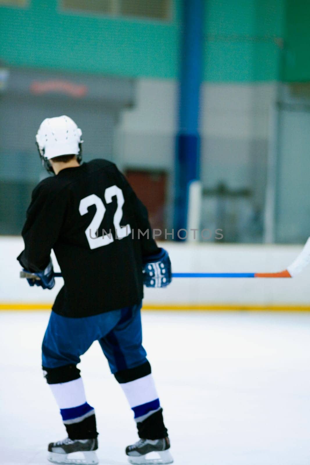 Rear view of an ice hockey player playing ice hockey