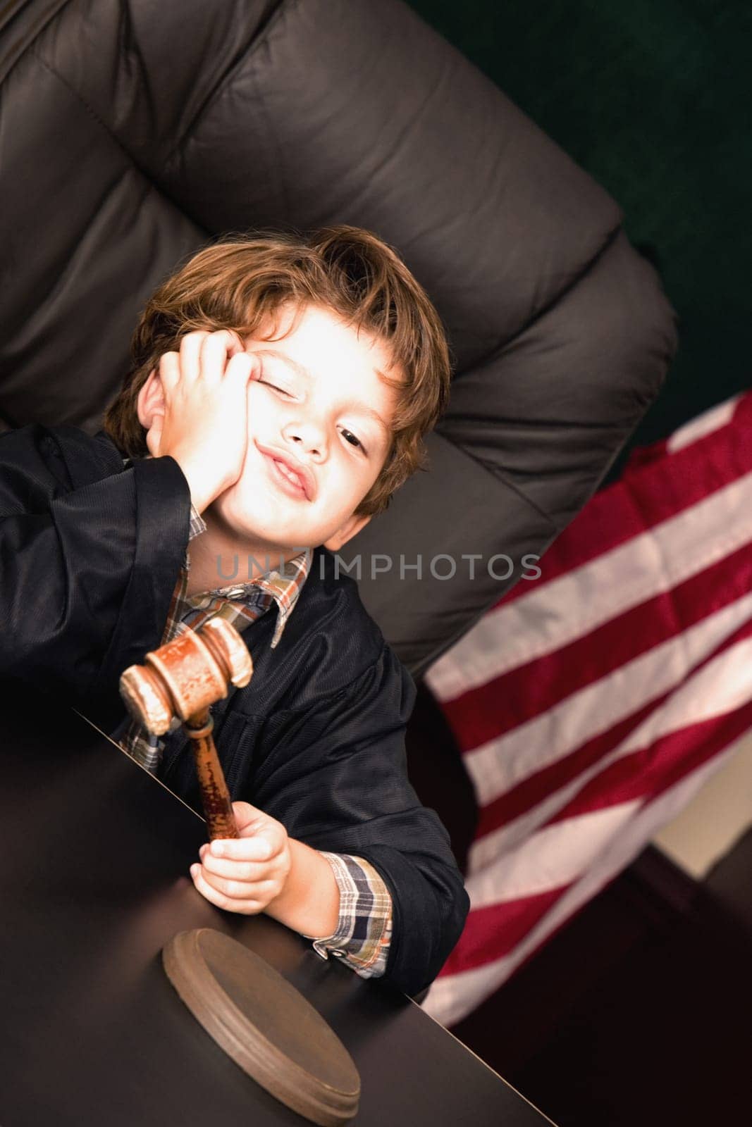 Boy imitating a judge