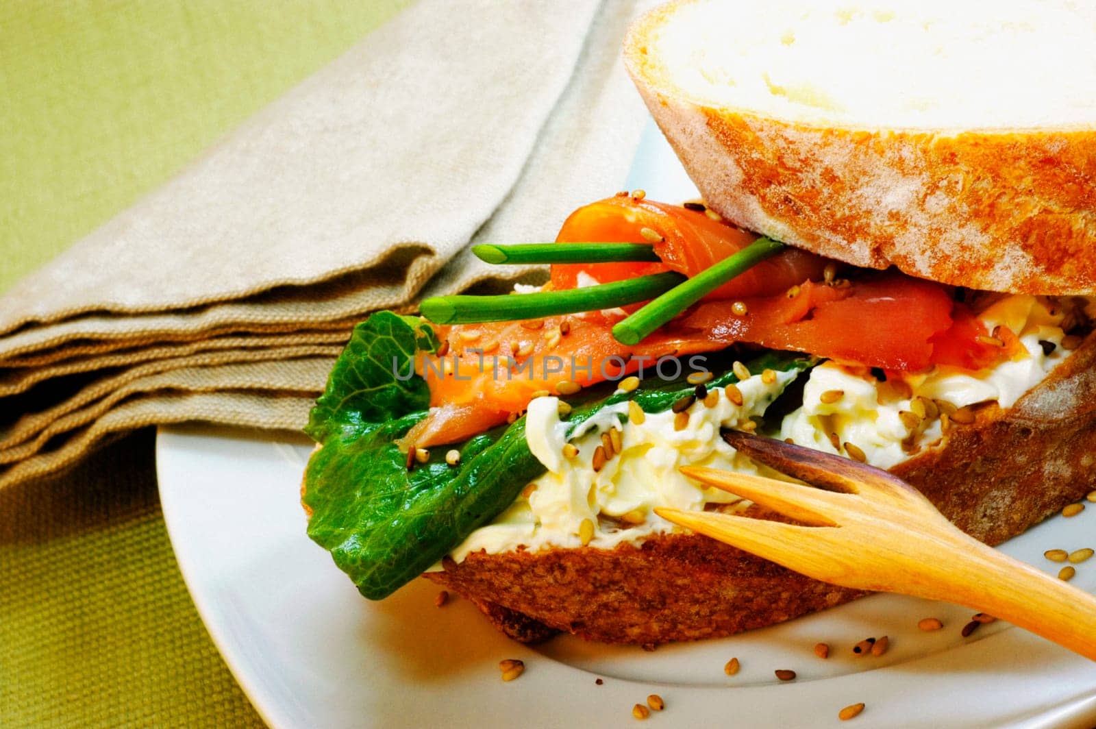 Close-up of a ham sandwich on a plate