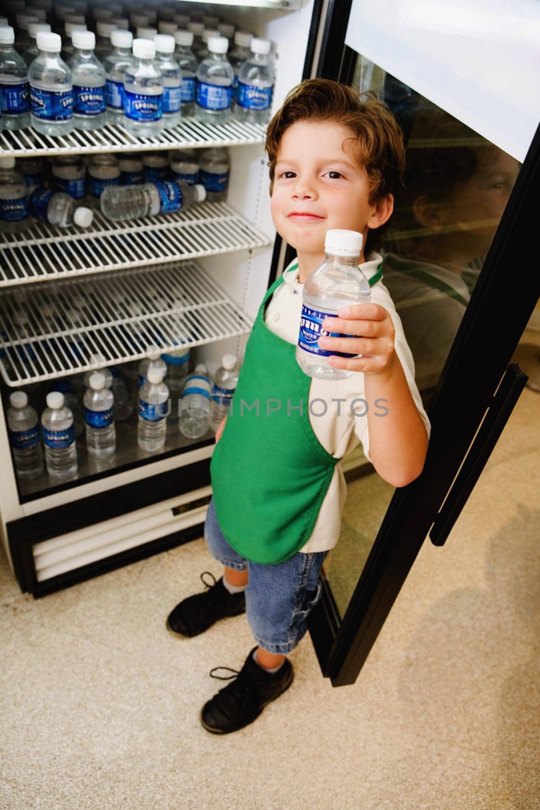 Boy holding a water bottle