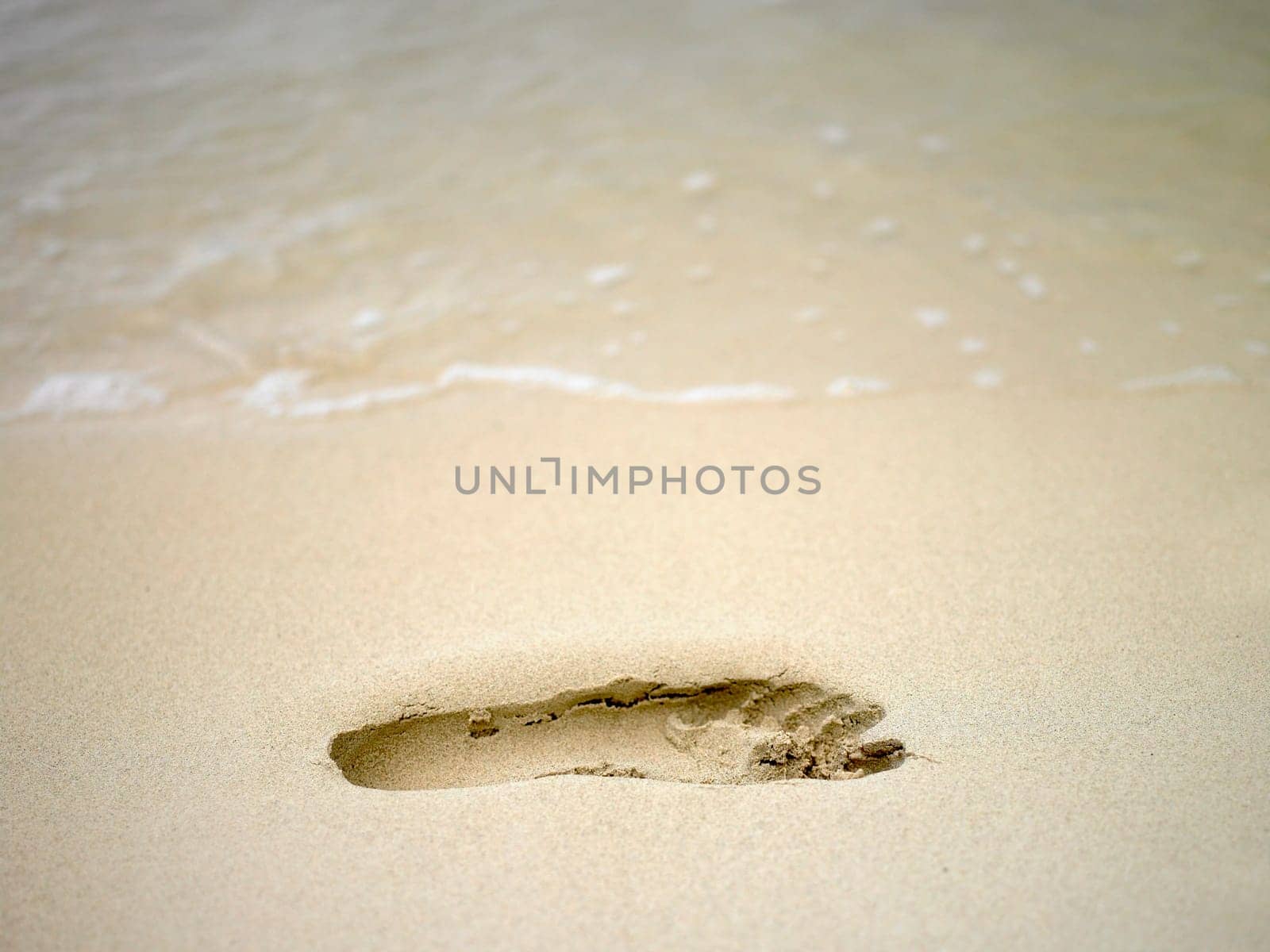 Close-up of a footprint in the sand