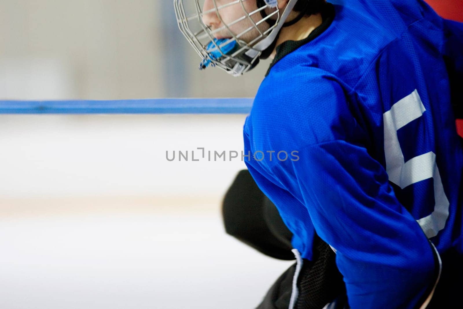 Side profile of an ice hockey player wearing a helmet