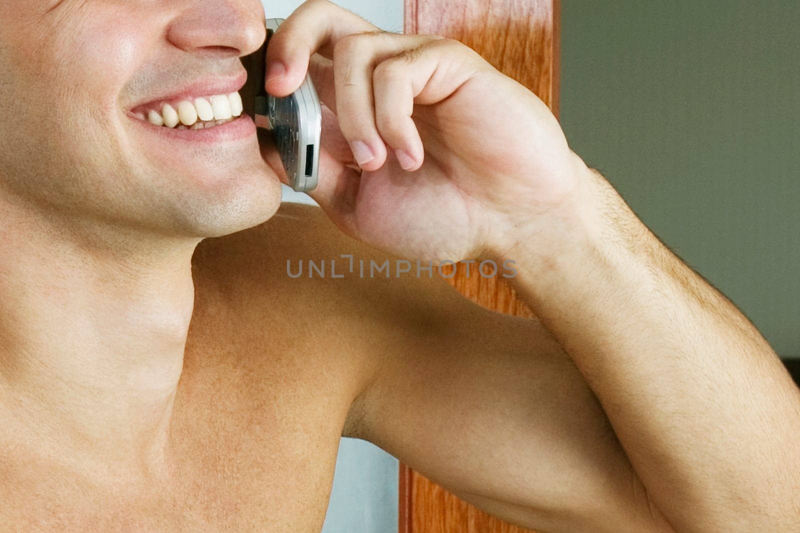 Close-up of a young man talking on a mobile phone