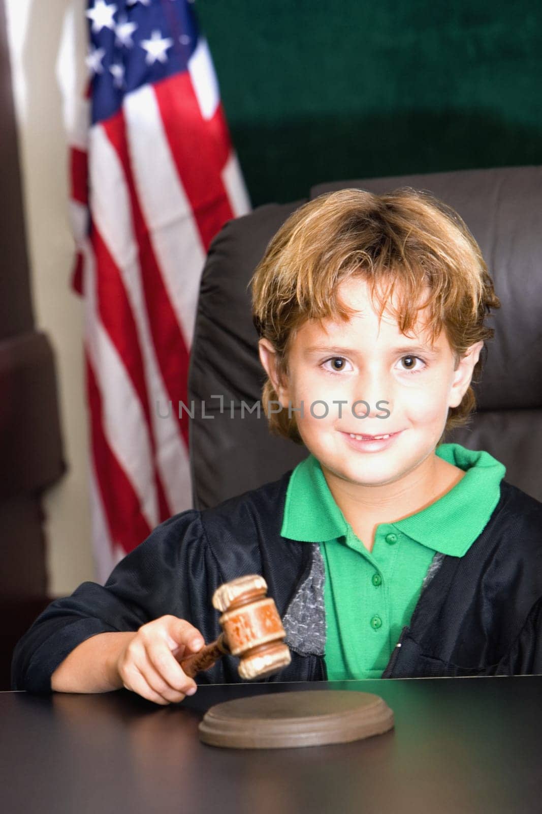Boy imitating a judge in a courthouse