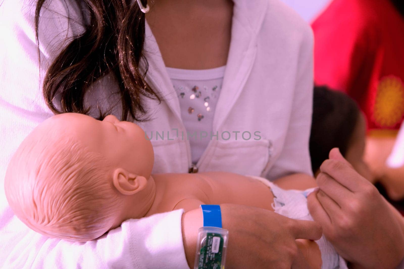 Close-up of a woman carrying a doll