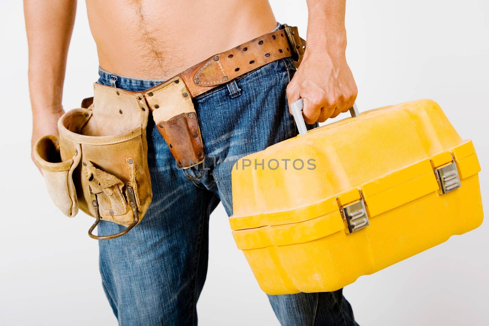 Mid section view of a man holding a toolbox
