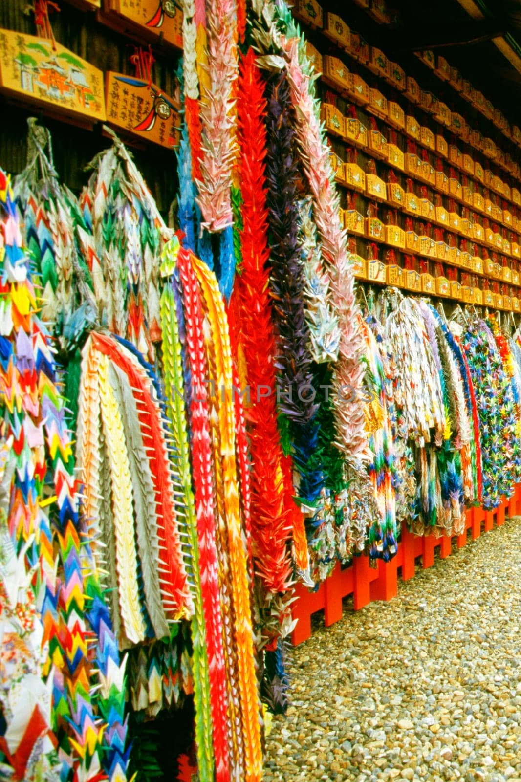 Large group of origami products hanging on the wall