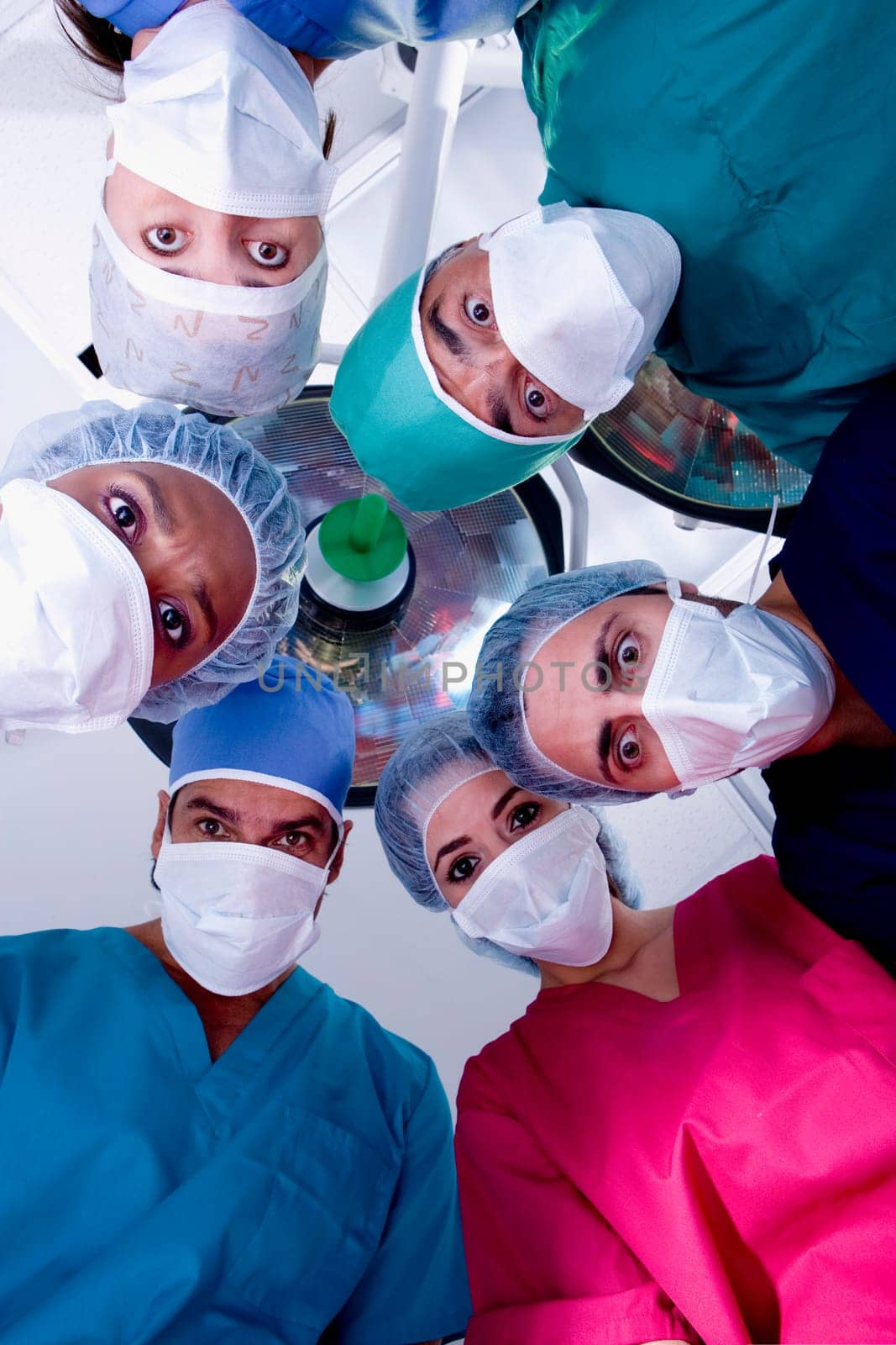 Low angle view of surgeons in an operating room