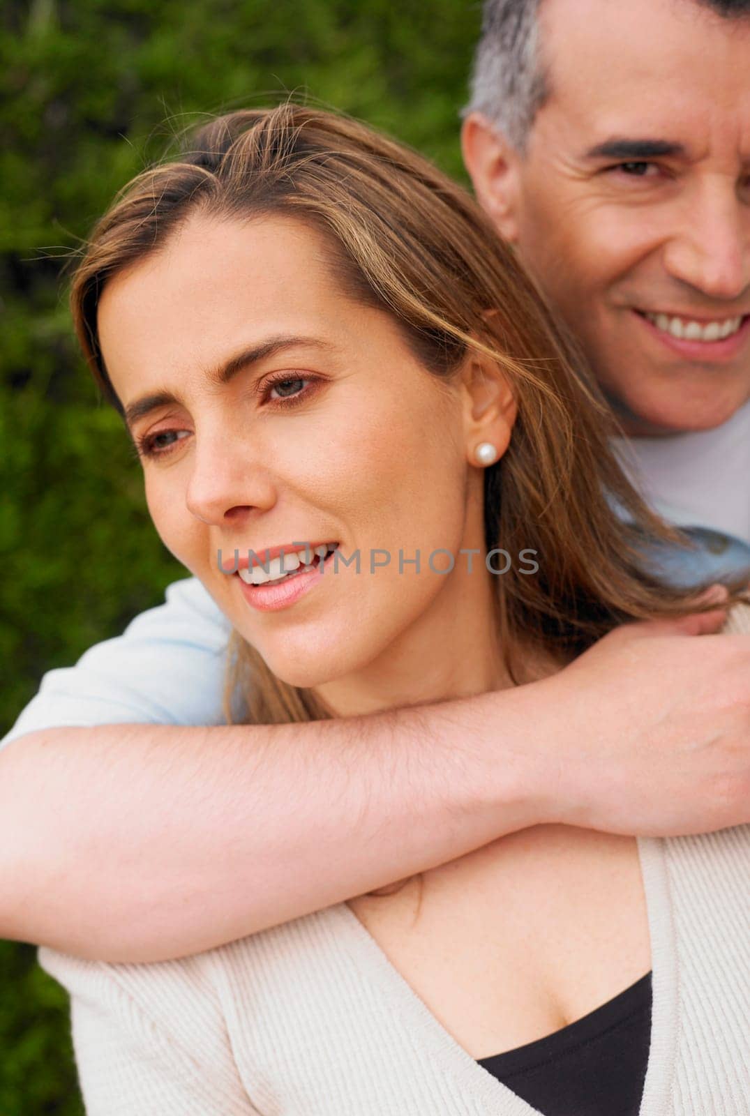 Portrait of a mid adult man embracing a mid adult woman