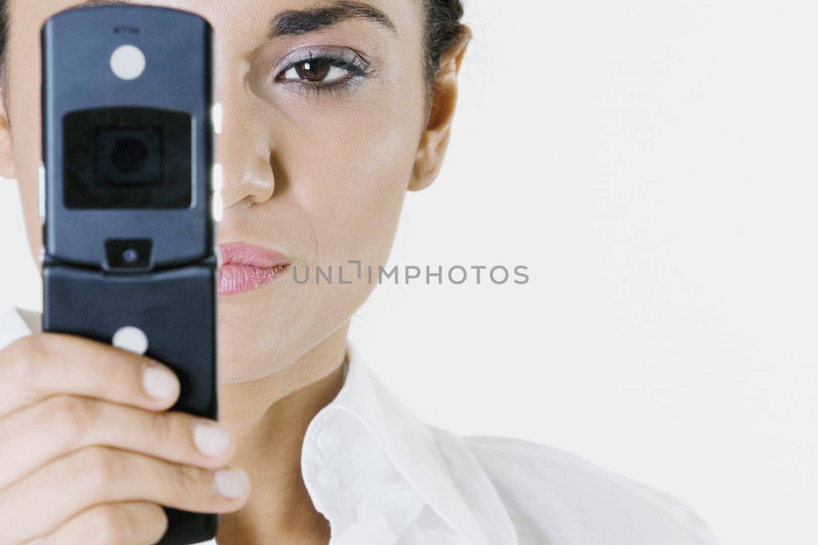 Close-up of a young woman holding a mobile phone
