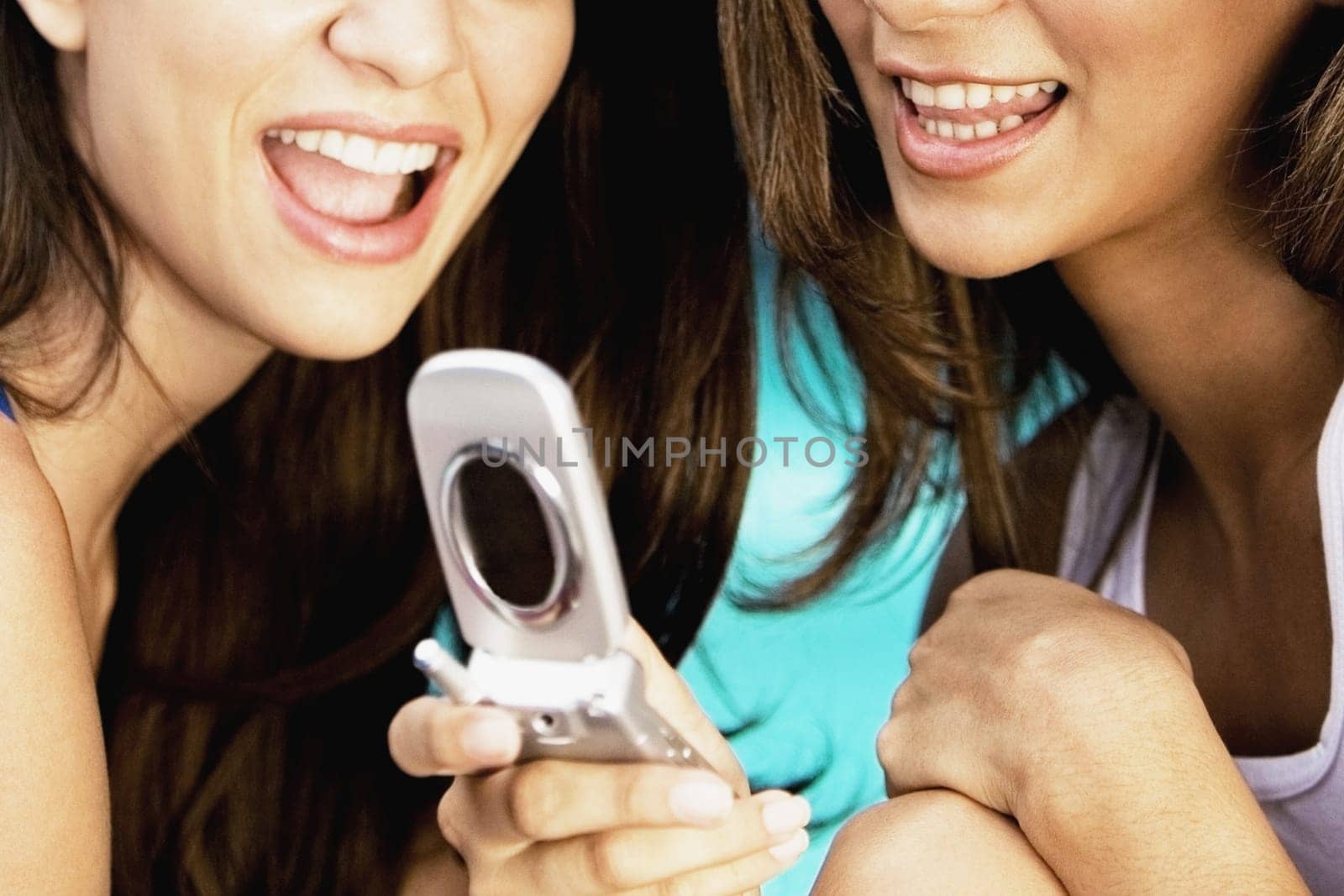 Close-up of a woman holding a mobile phone