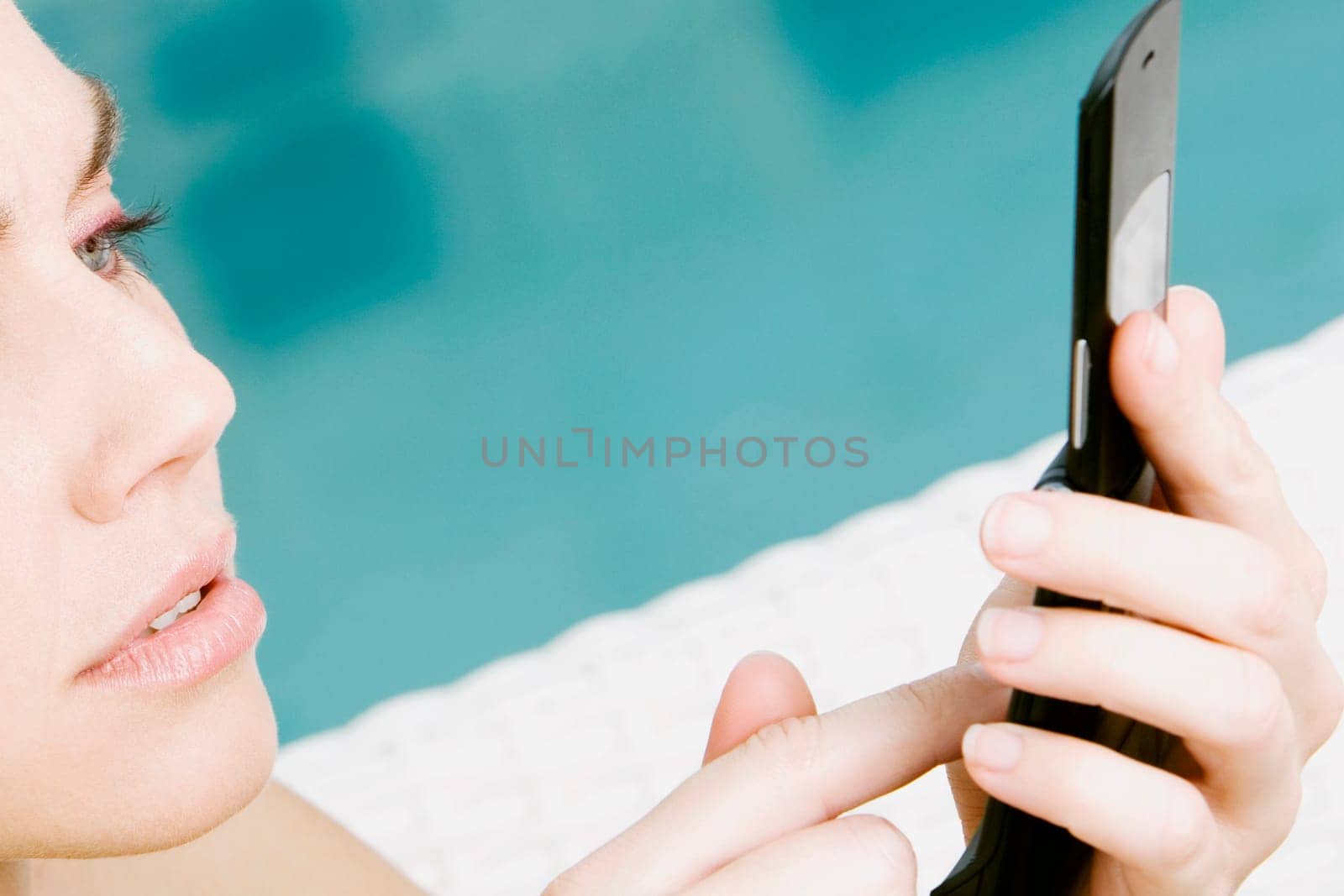 Close-up of a young woman using a mobile phone