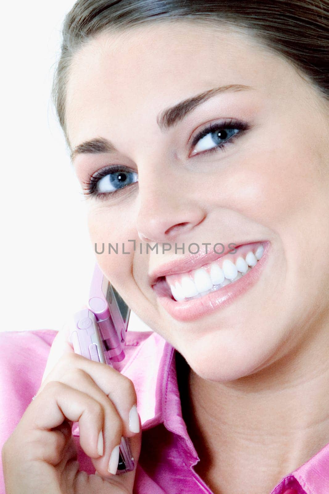 Portrait of a young woman talking on a mobile phone
