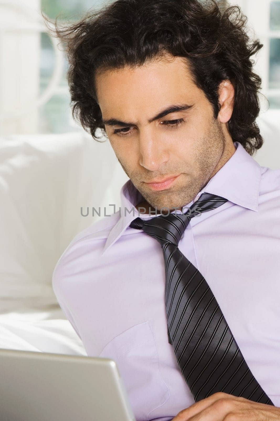 Close-up of a businessman using a laptop