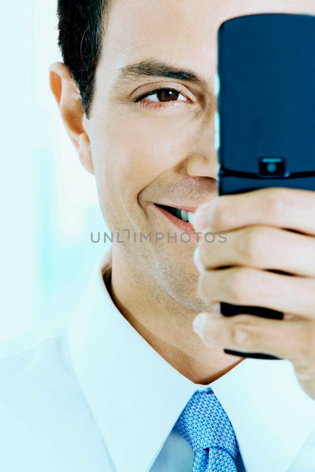 Close-up of a businessman looking at a mobile phone
